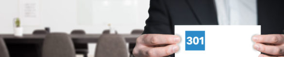 Man in conference room holding card